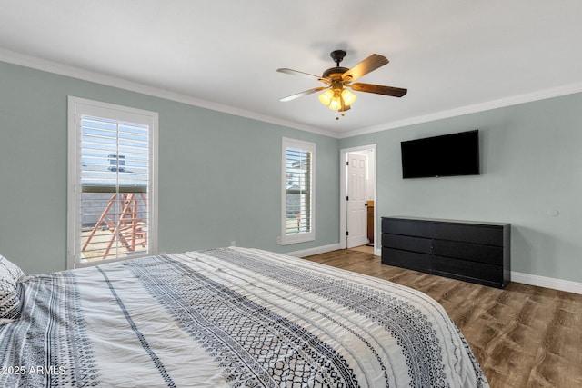 bedroom with crown molding, wood finished floors, baseboards, and a ceiling fan