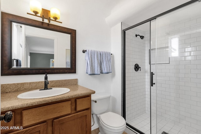 full bath with a shower stall, toilet, and vanity