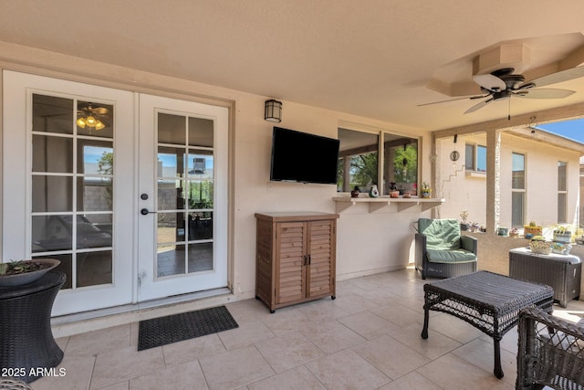 view of patio / terrace featuring french doors and a ceiling fan