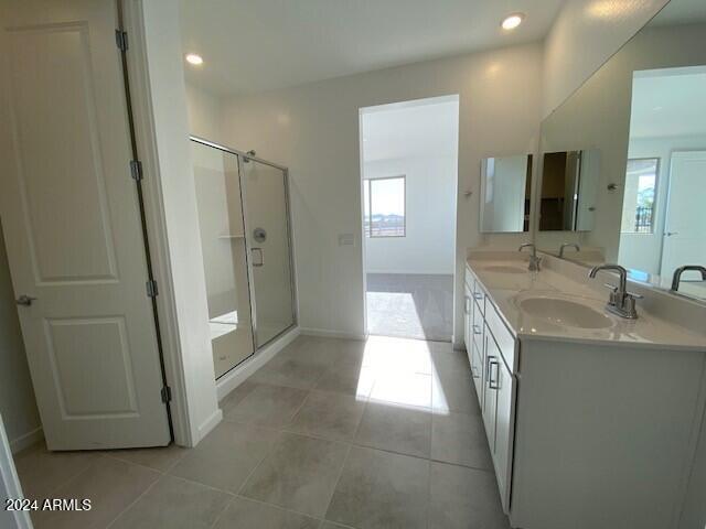 bathroom with vanity, tile patterned floors, and an enclosed shower