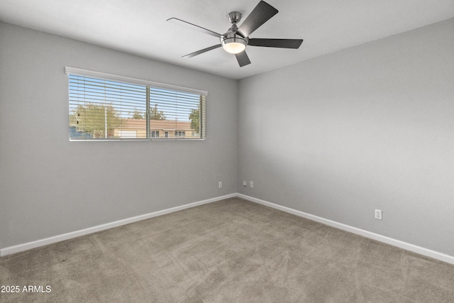 unfurnished room with light carpet and ceiling fan