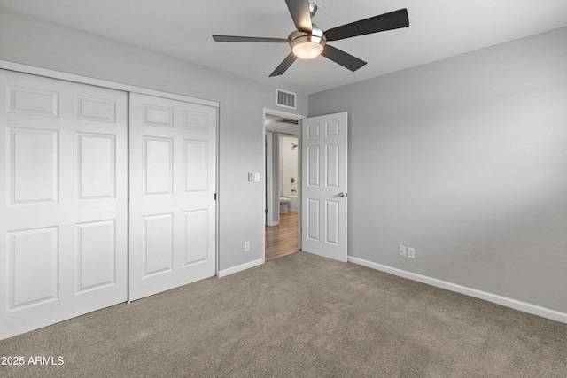 unfurnished bedroom featuring ceiling fan, a closet, and carpet floors