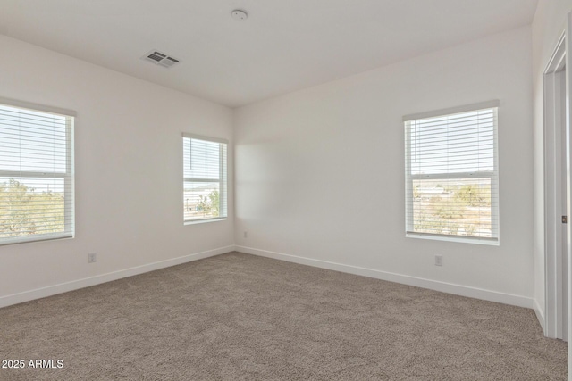 1552 N Pueblo Dr, Apache Junction, AZ 85120 - empty room with healthy amount of natural light and carpet