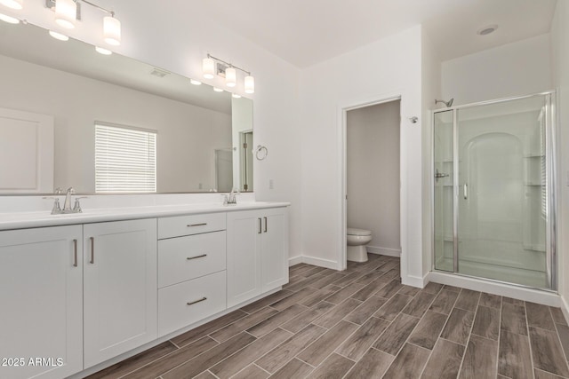 1552 N Pueblo Dr, Apache Junction, AZ 85120 - bathroom featuring double vanity, wood finished floors, and a shower stall