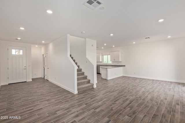 1552 N Pueblo Dr, Apache Junction, AZ 85120 - foyer entrance featuring wood finished floors, stairway, and recessed lighting