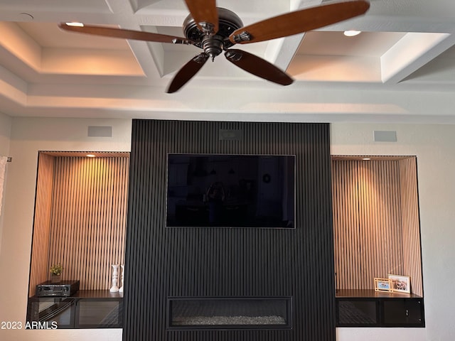 interior details featuring ceiling fan, beamed ceiling, and coffered ceiling