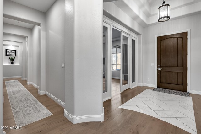 entryway with light hardwood / wood-style flooring