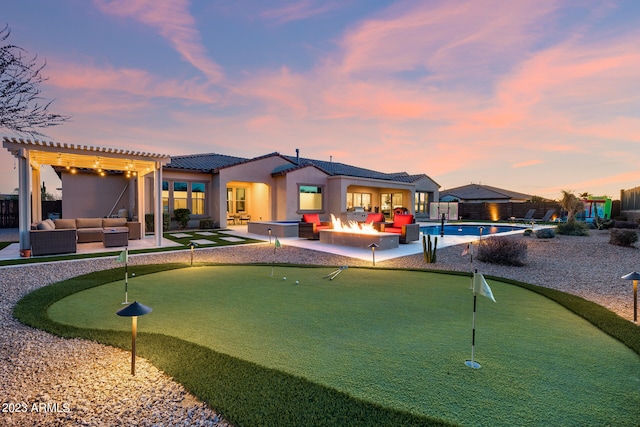 exterior space featuring a pergola, a patio, and an outdoor living space with a fire pit