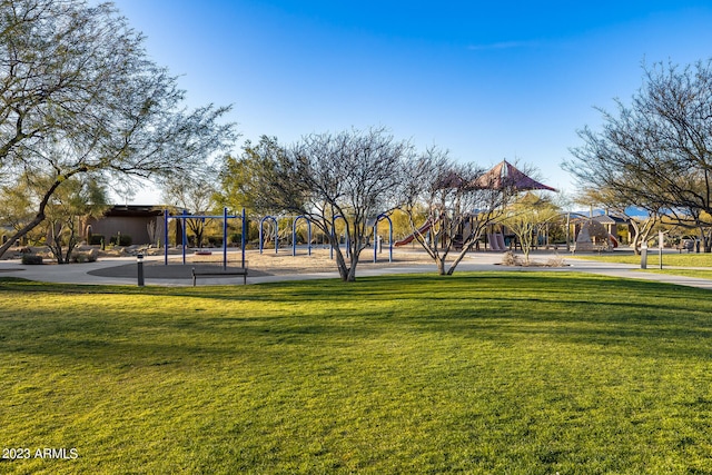 view of community with a lawn and a playground