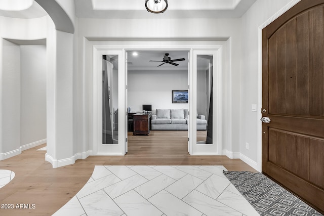 entryway featuring ceiling fan and light hardwood / wood-style floors