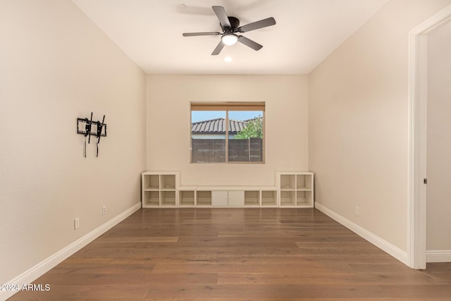 spare room featuring dark hardwood / wood-style flooring and ceiling fan