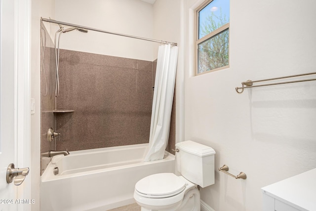 bathroom featuring shower / bath combo and toilet