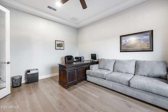 office space with ceiling fan and light hardwood / wood-style flooring