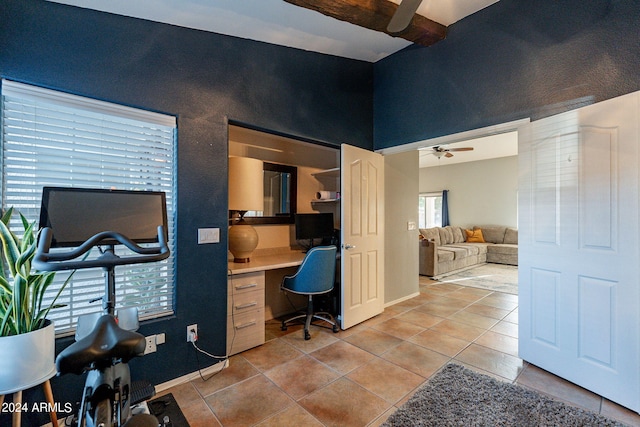 home office with light tile patterned floors, a ceiling fan, baseboards, and built in study area