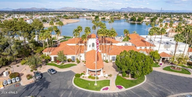 birds eye view of property featuring a water and mountain view