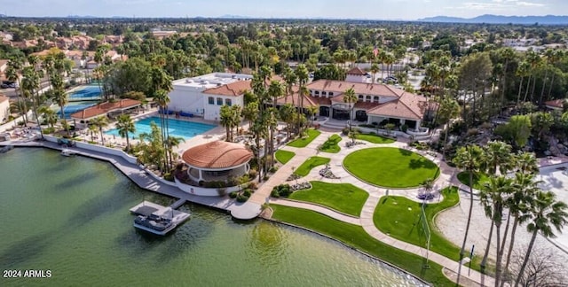 birds eye view of property with a water view