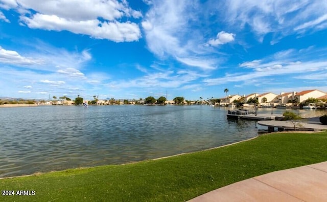 property view of water with a dock