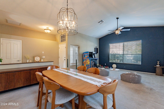 dining room with vaulted ceiling, ceiling fan, and light colored carpet