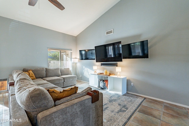 tiled living room featuring visible vents, baseboards, high vaulted ceiling, and a ceiling fan