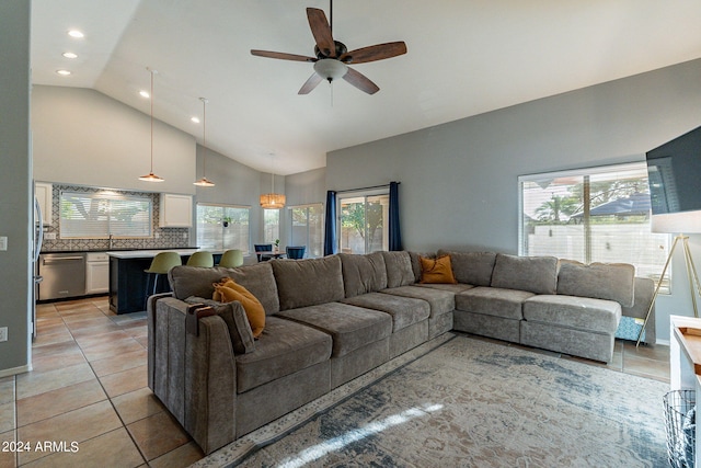 living room featuring high vaulted ceiling, light tile patterned floors, and ceiling fan