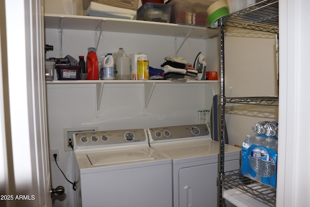 washroom featuring laundry area and washing machine and clothes dryer