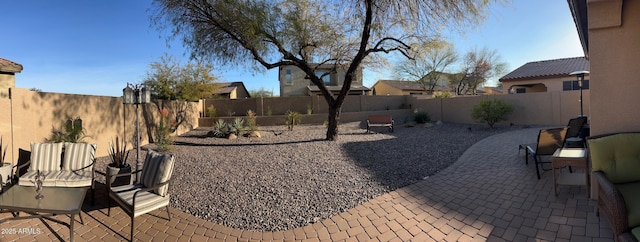 view of yard with a patio area and a fenced backyard