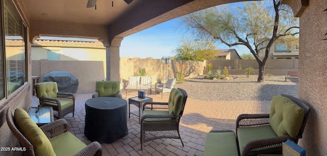 view of patio featuring a fenced backyard, grilling area, and an outdoor hangout area