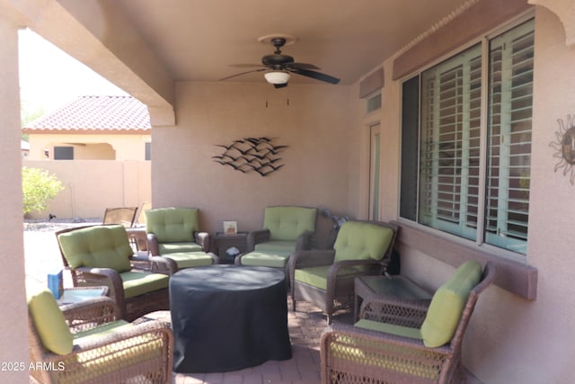 view of patio / terrace with an outdoor living space and ceiling fan