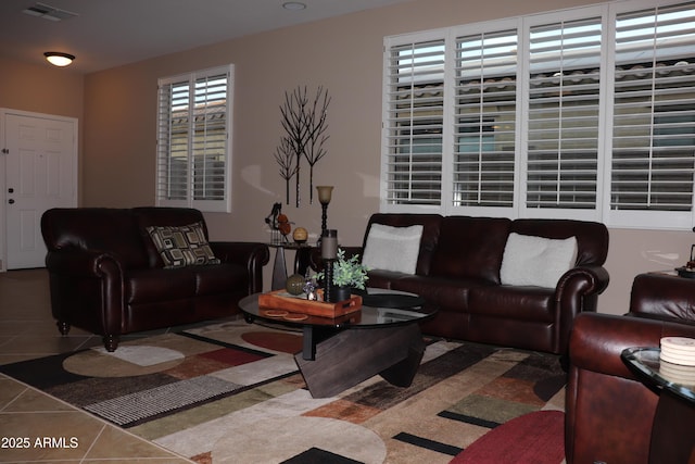 living room with tile patterned flooring