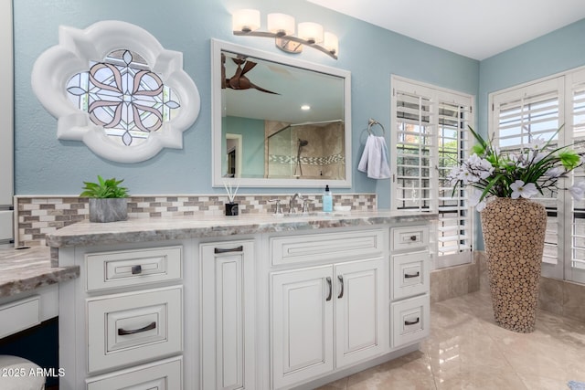 full bathroom featuring vanity and walk in shower