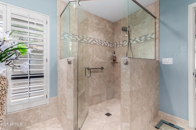 full bath featuring tiled shower