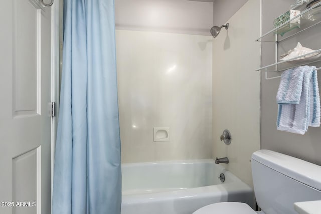 bathroom with shower / bath combination with curtain and toilet