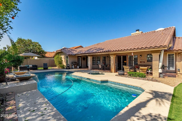 view of pool featuring an outdoor living space, a fenced in pool, an outdoor hot tub, and a patio area