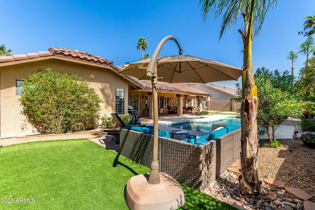 view of swimming pool featuring a patio area, a lawn, a fenced backyard, and a fenced in pool