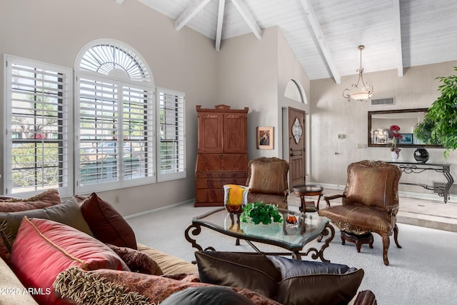 carpeted living room with visible vents, baseboards, high vaulted ceiling, and beamed ceiling