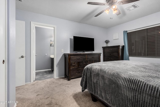 carpeted bedroom with a ceiling fan, visible vents, and baseboards