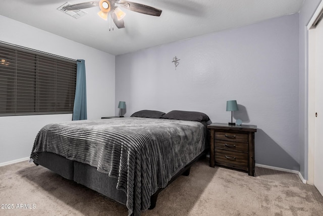 bedroom with baseboards, visible vents, and carpet flooring