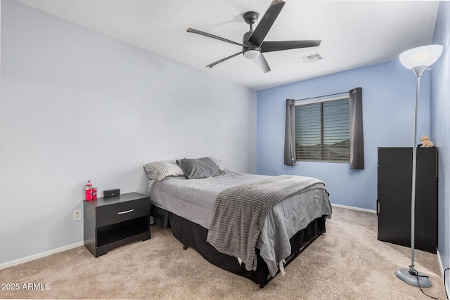 bedroom with light colored carpet, visible vents, and baseboards