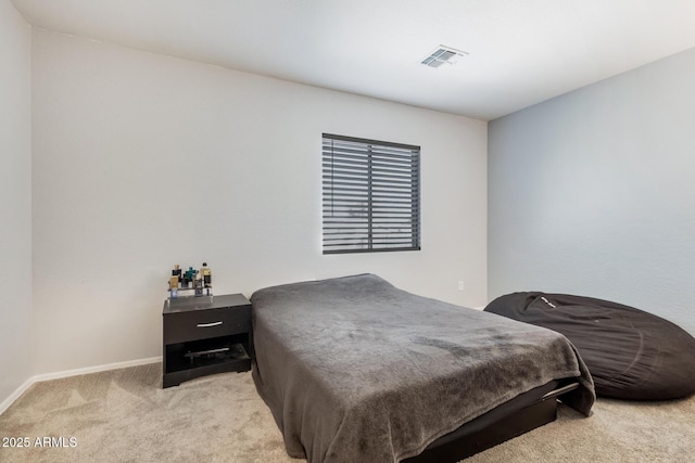 bedroom featuring visible vents, light carpet, and baseboards