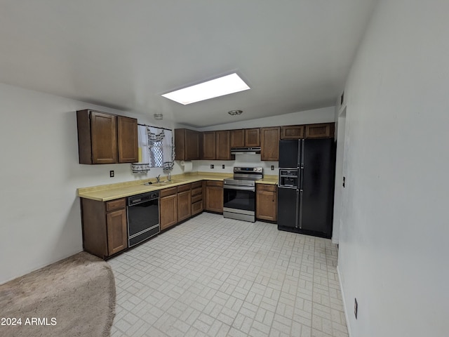 kitchen featuring under cabinet range hood, a sink, dark brown cabinets, light countertops, and black appliances