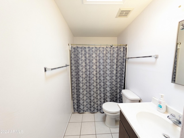 bathroom featuring visible vents, toilet, tile patterned floors, curtained shower, and vanity