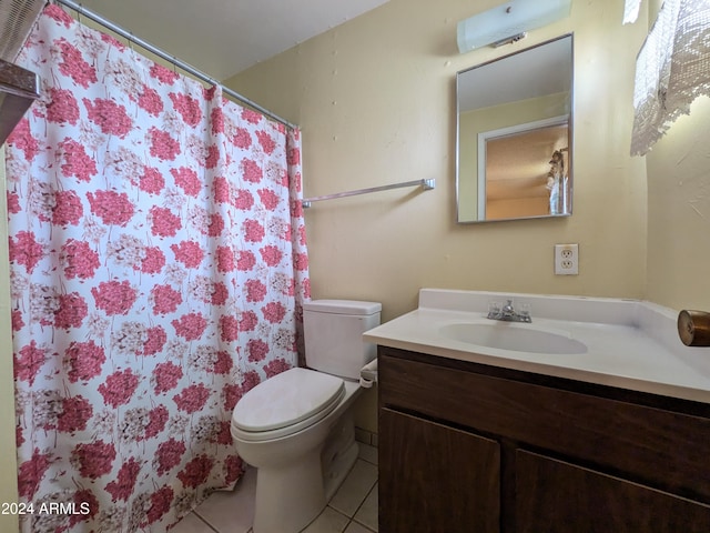 bathroom with vanity, curtained shower, tile patterned flooring, and toilet