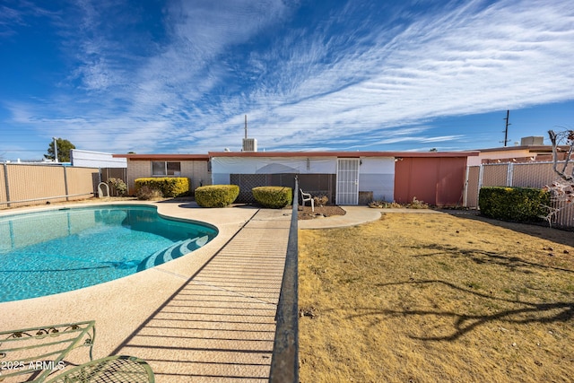 view of swimming pool with fence and a fenced in pool