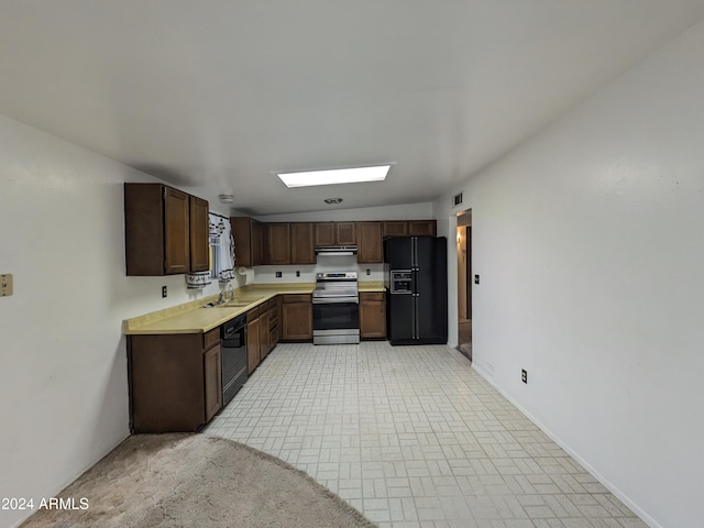 kitchen with dark brown cabinetry, visible vents, light countertops, black appliances, and a sink