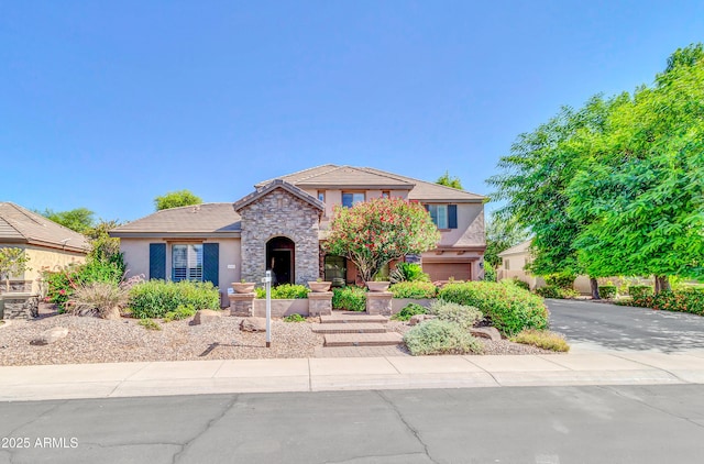 2383 E Zion Way, Chandler, AZ 85249 - traditional home with stucco siding, stone siding, concrete driveway, and an attached garage
