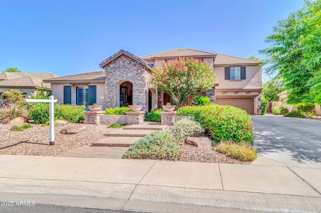 2383 E Zion Way, Chandler, AZ 85249 - view of front facade featuring stucco siding, a garage, concrete driveway, and stone siding