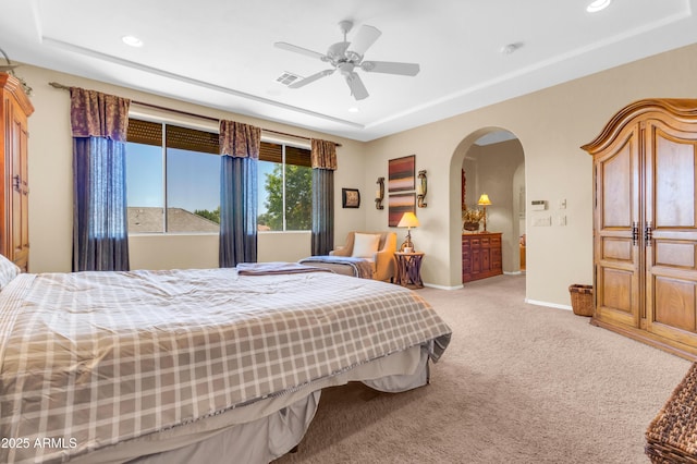 2383 E Zion Way, Chandler, AZ 85249 - bedroom with arched walkways, carpet floors, recessed lighting, a tray ceiling, and a ceiling fan