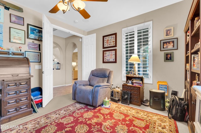 2383 E Zion Way, Chandler, AZ 85249 - living area featuring arched walkways, a ceiling fan, and carpet flooring