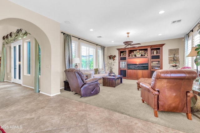 2383 E Zion Way, Chandler, AZ 85249 - living room with arched walkways, healthy amount of natural light, carpet flooring, recessed lighting, and tile patterned flooring