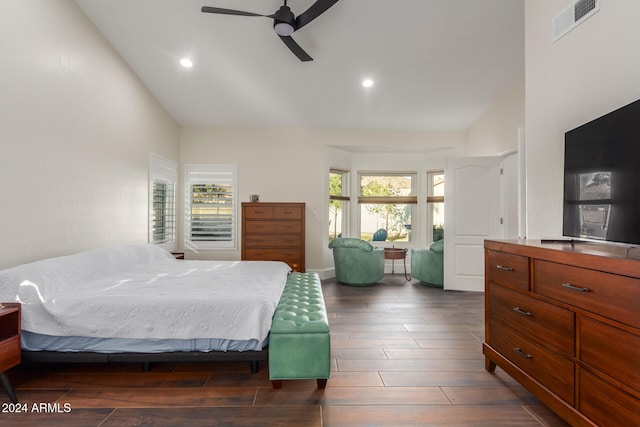 bedroom featuring dark hardwood / wood-style floors, high vaulted ceiling, and ceiling fan